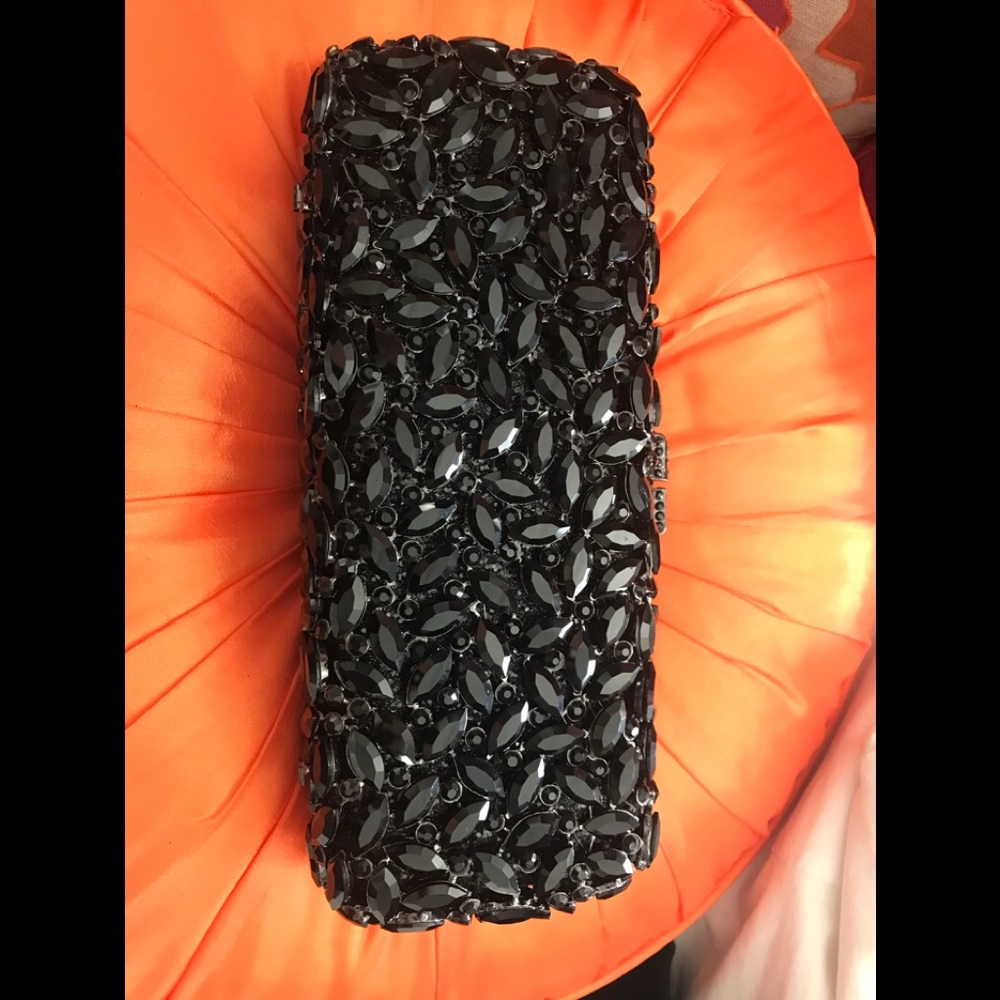 Black rhinestone encrusted clutch. Substantial
